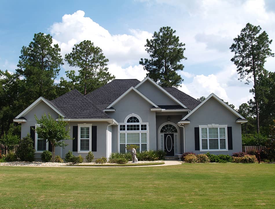 Grey house with a black roof