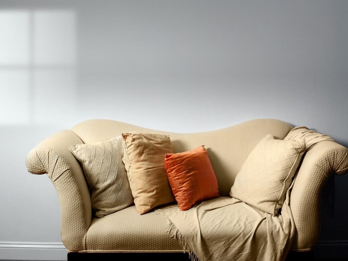 beige sofa grey cushions