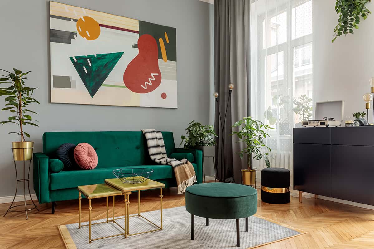 Gold or Copper Metal and a Green Couch