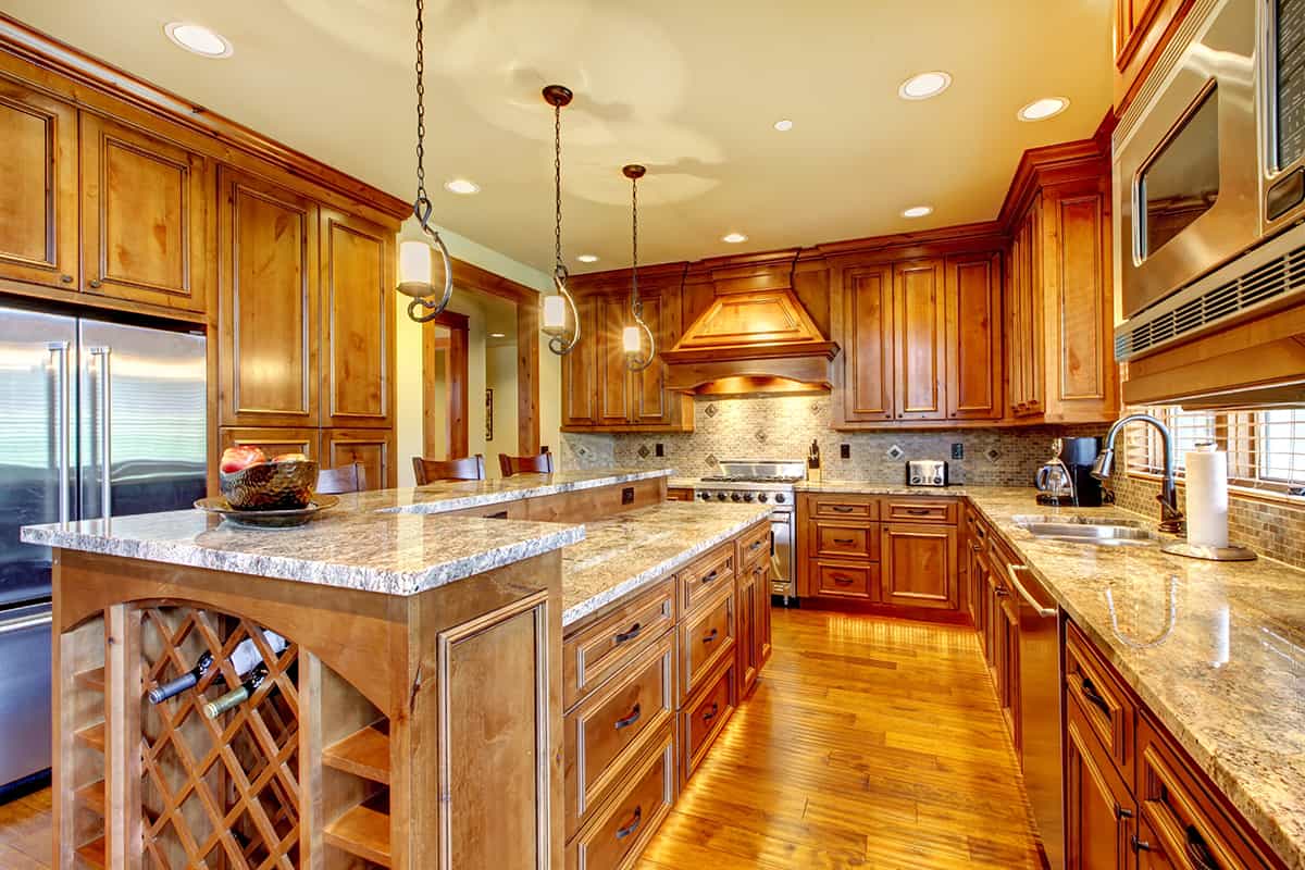 Granite Countertops and Light Wood Island