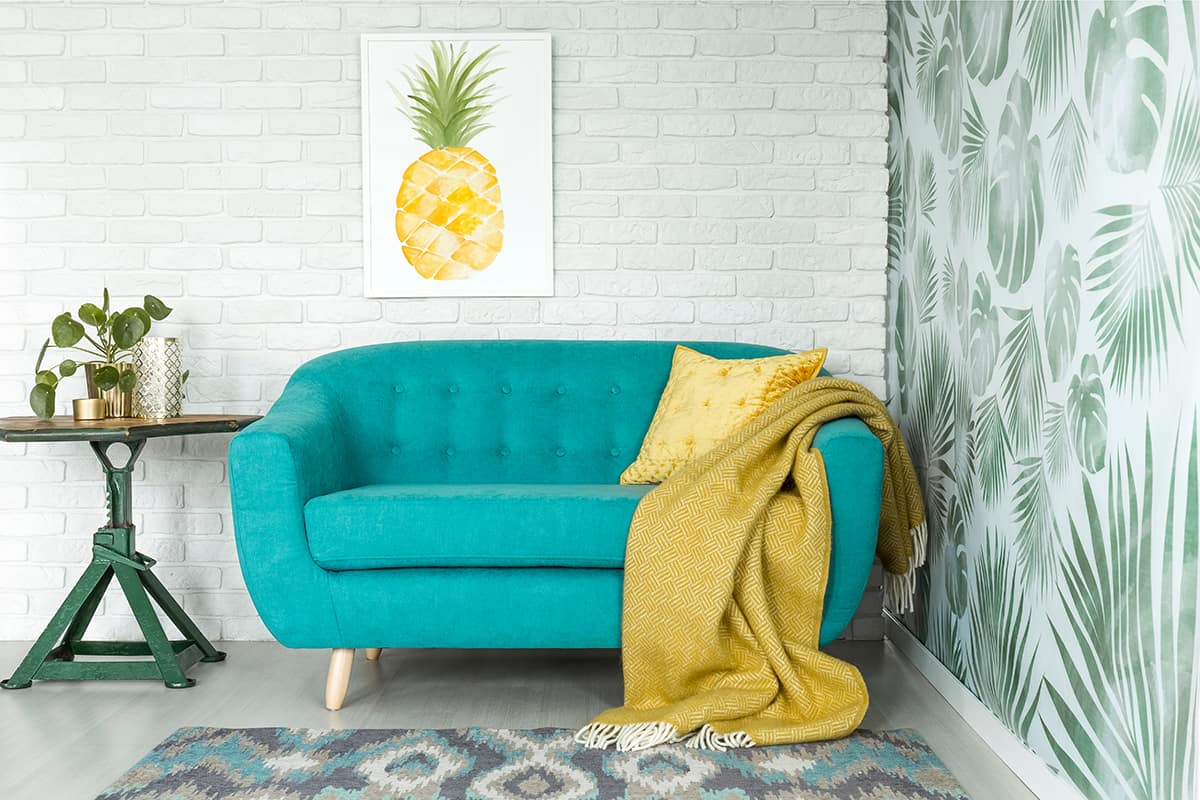 Artwork and a Green Couch