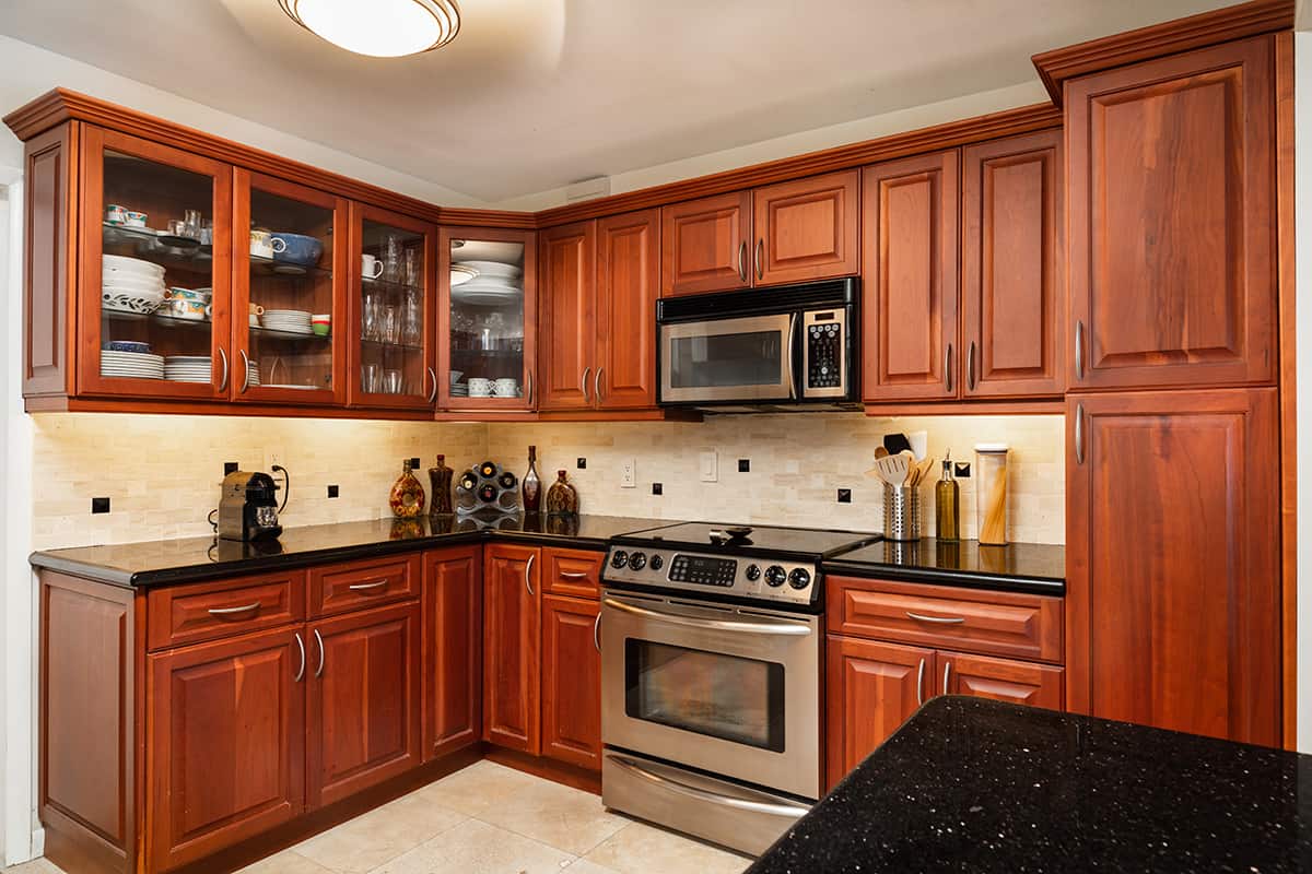 Beige Tile Floors and Cherry Cabinets