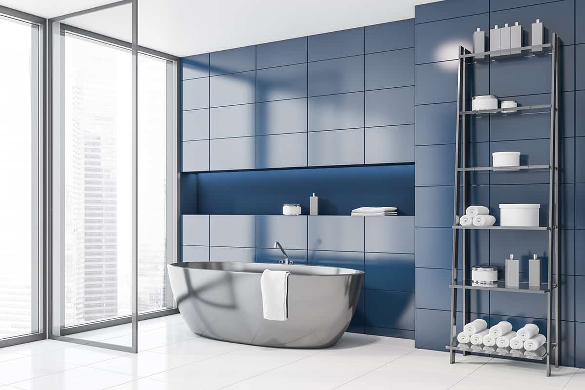 Dark Blue Walls and Light Gray Bathroom Cabinets