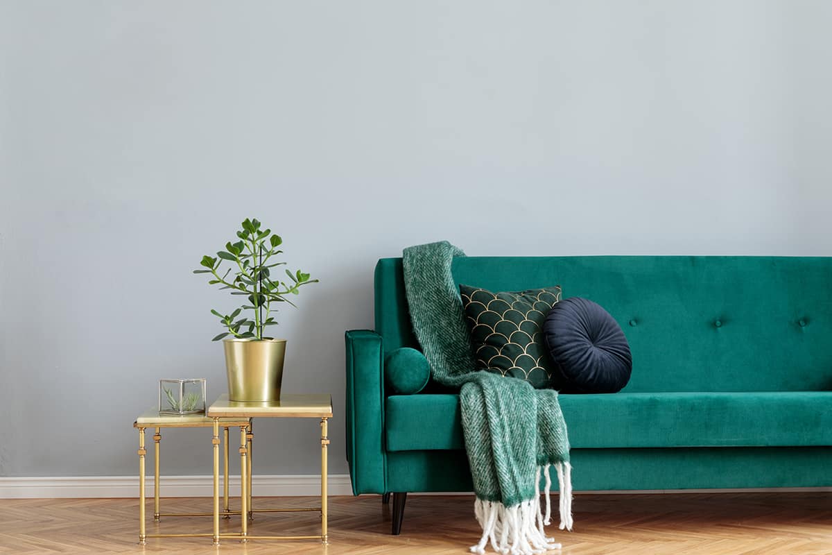 Green Couch and Grey Walls