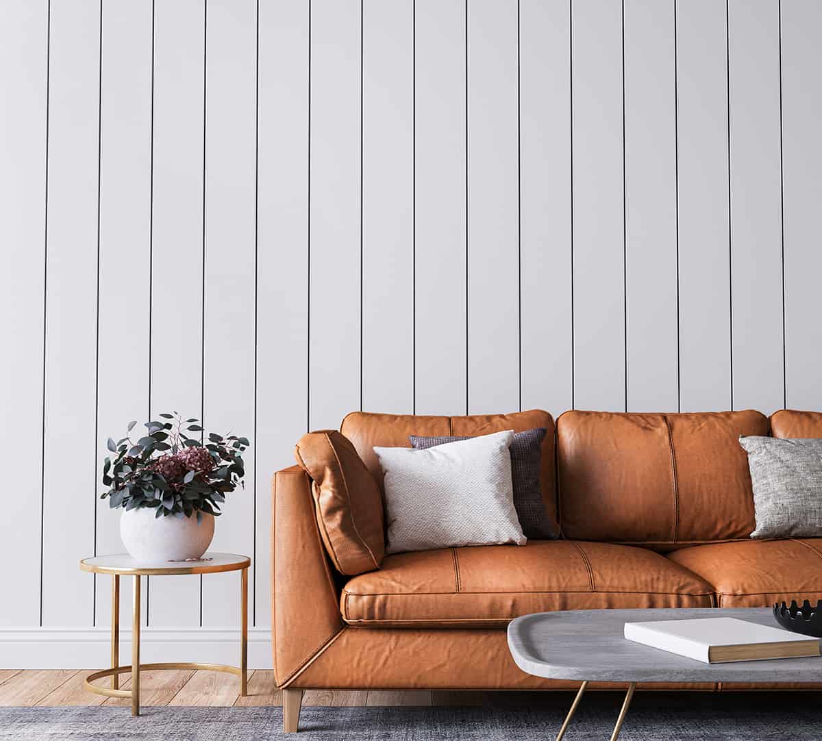 Orange Couch and Grey Walls