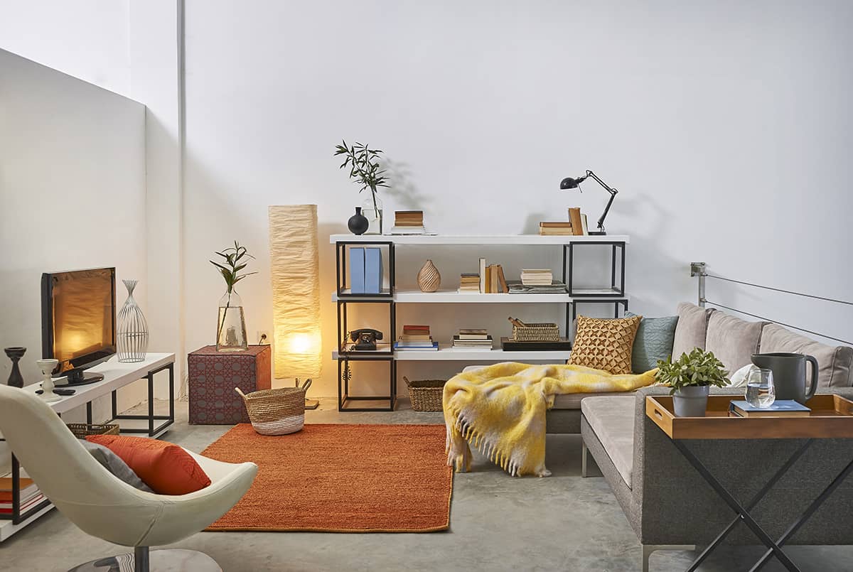 Orange Rug and Grey Flooring