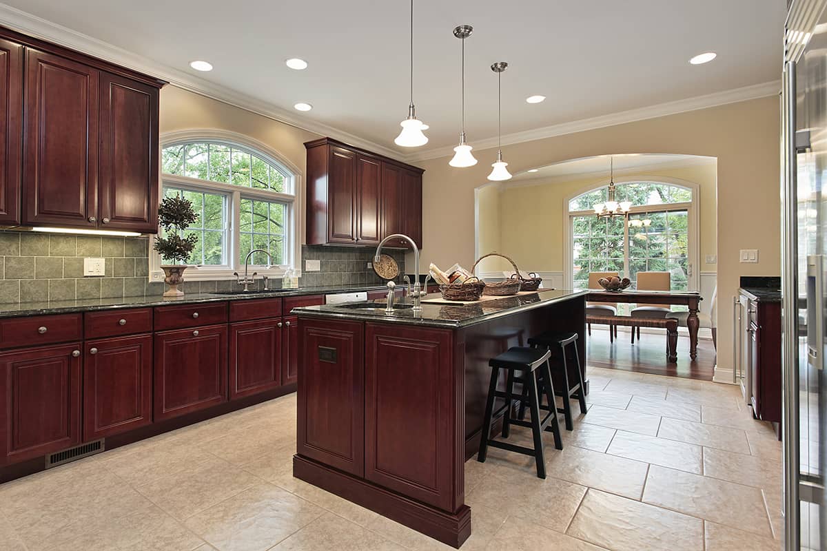 White Tile Floors and Cherry Cabinets