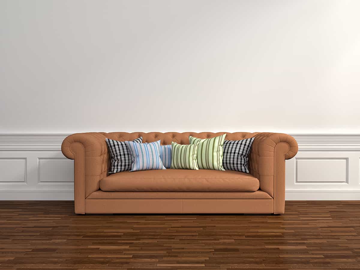 White walls and brown sofa