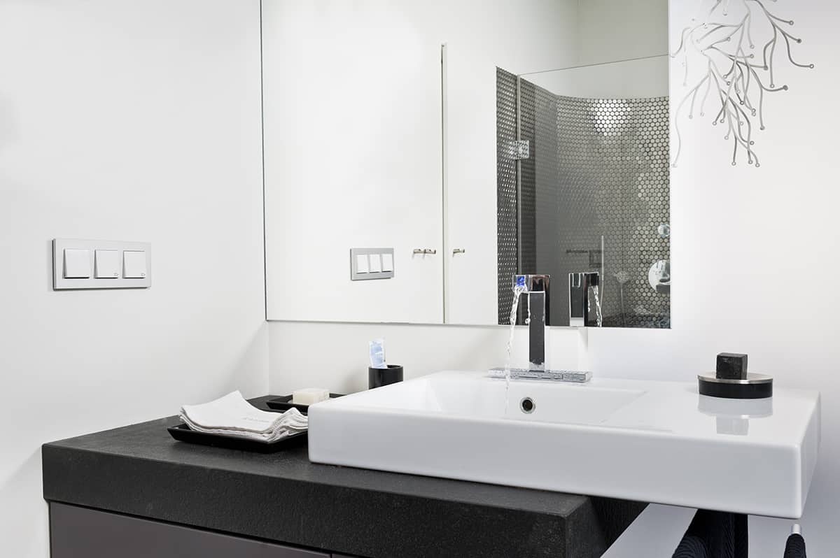 White Walls and Dark Gray Bathroom Cabinets