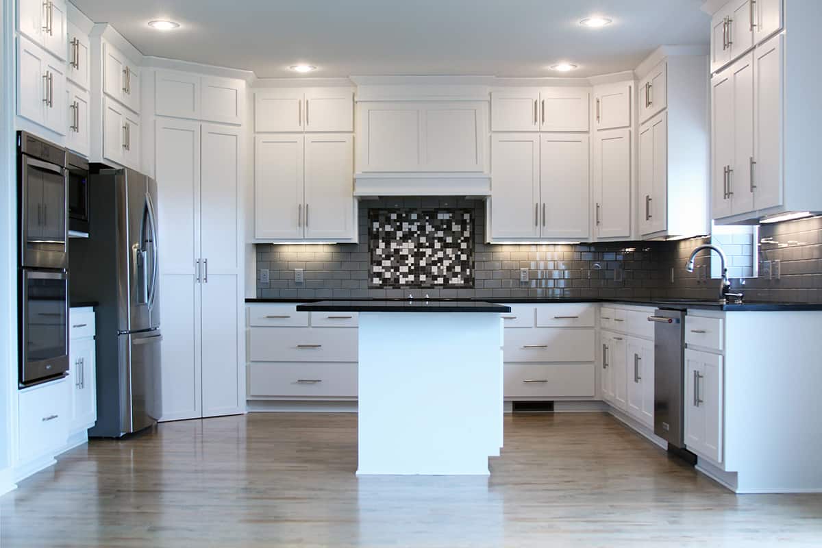 7 Charming White Kitchen Cabinets with Black Countertops - Homenish