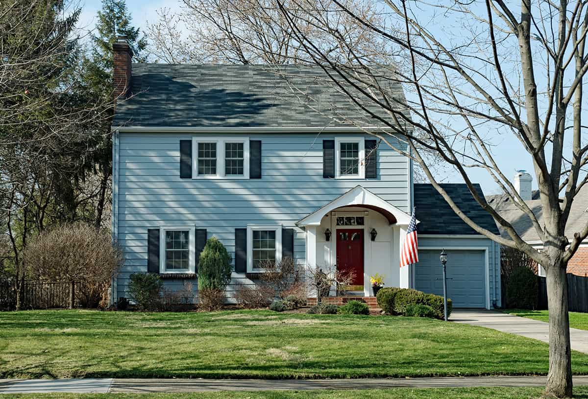 Light Blue House with White Trim and Black Shutters