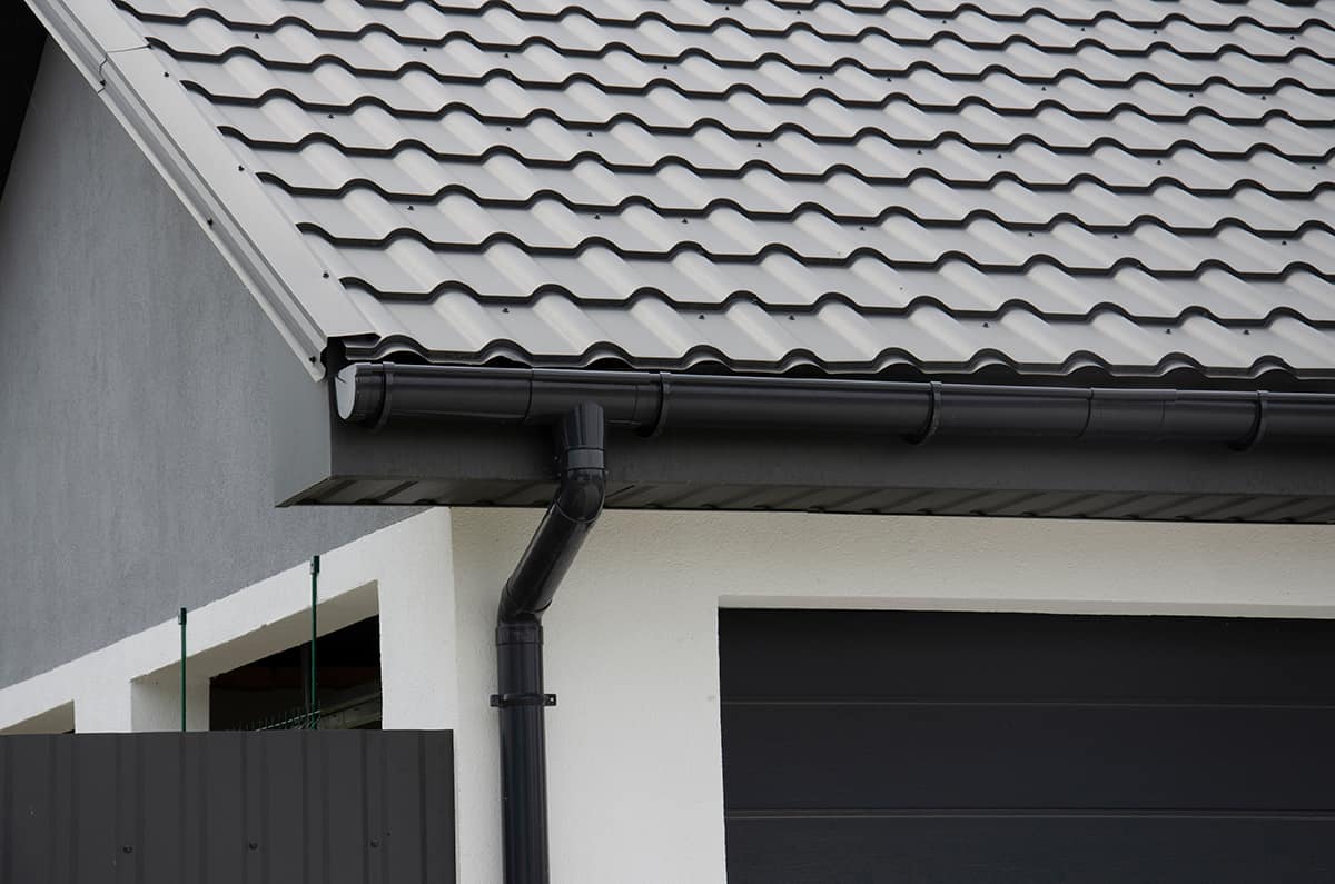 White house with Black Gutters