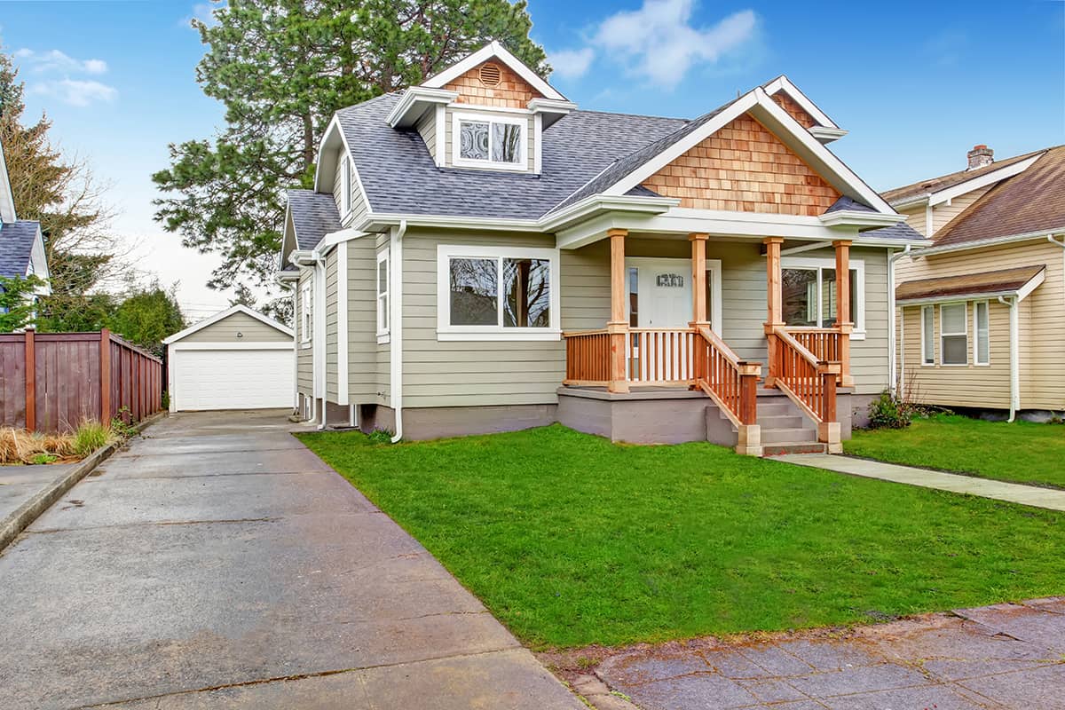 Greyish Green Siding with Brown Trim