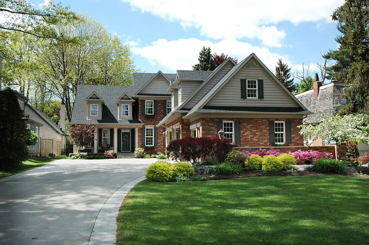 Red Brick with Green Siding and Brown Trim