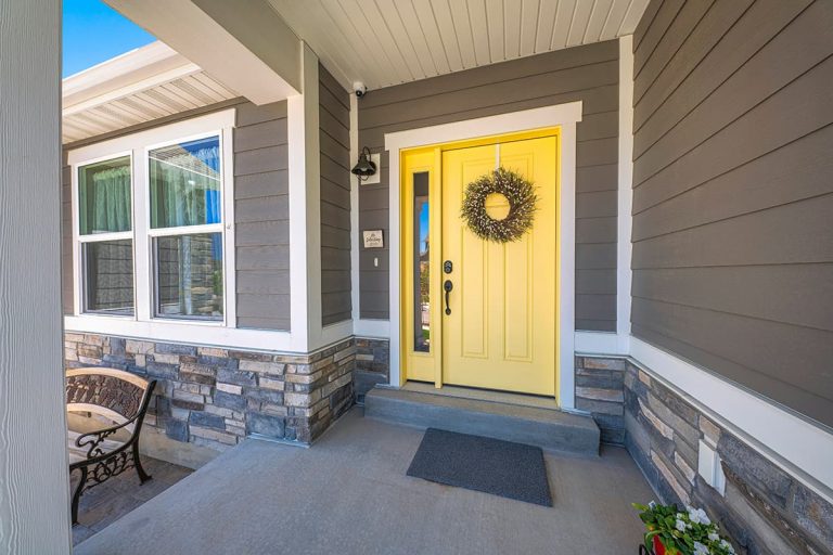 Modern Grey House with White Trim and Bold Yellow Door Design