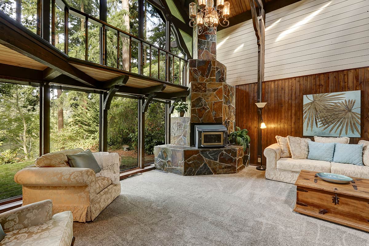 Corner Fireplace in Glass Walled Living Room