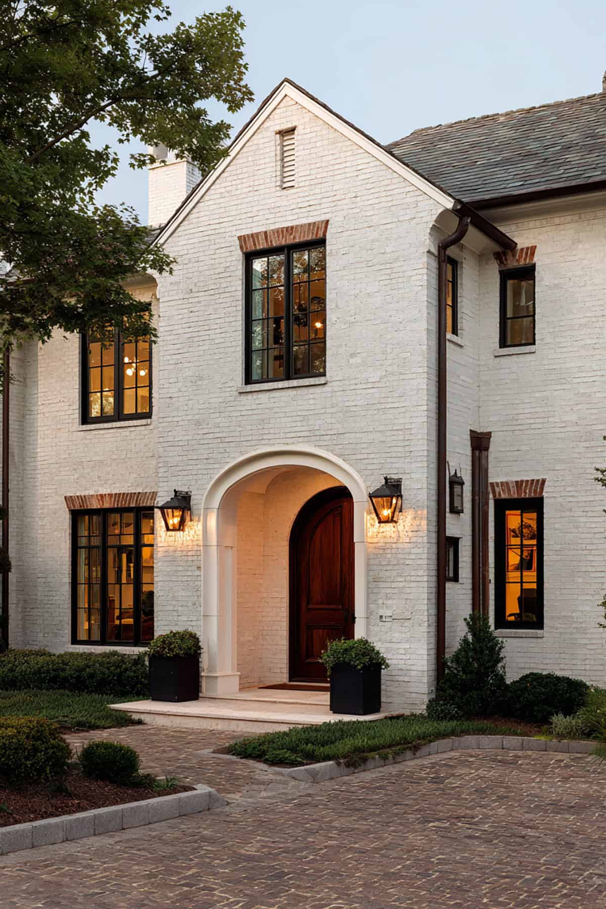 White Brick Entry With a Deep Arched Doorway