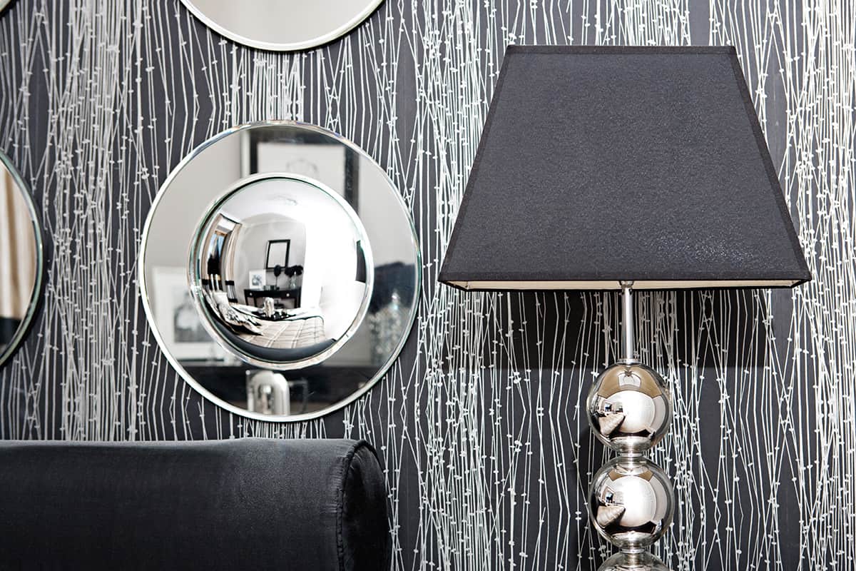 Black Table lamp and silver-framed mirror