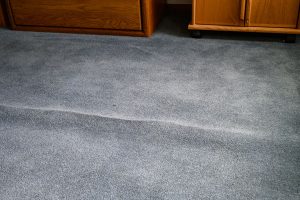 How to Get Wrinkles and Creases Out of Carpet