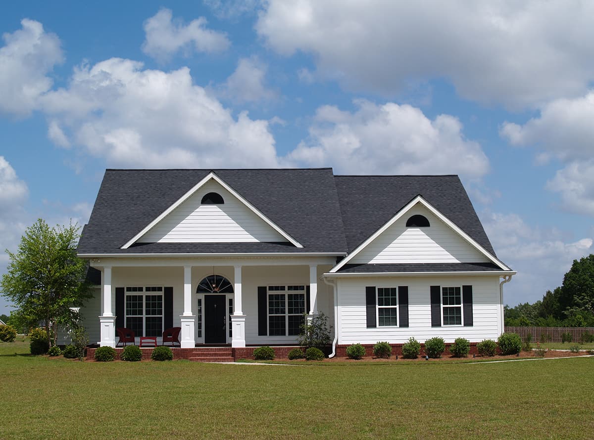 Black Metal Roof with White Siding