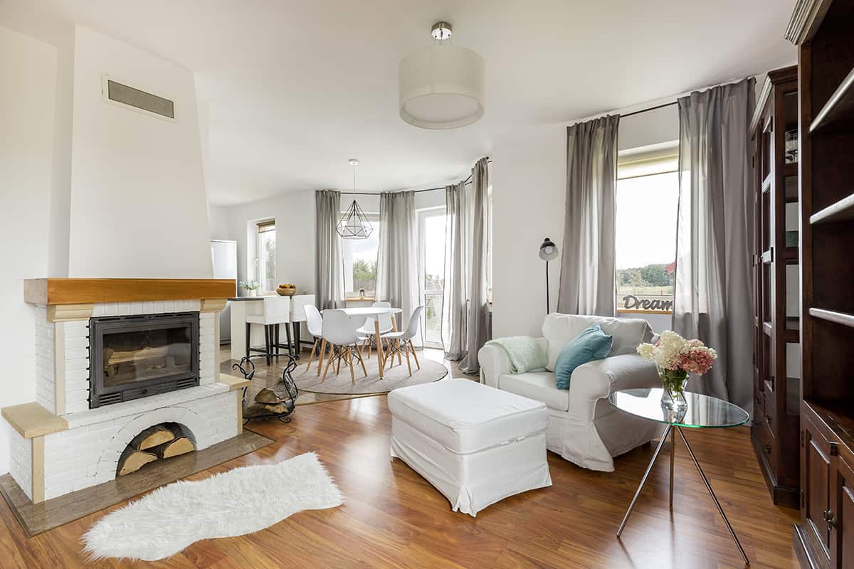 L Shaped Living Room Seating Layout with a Fireplace