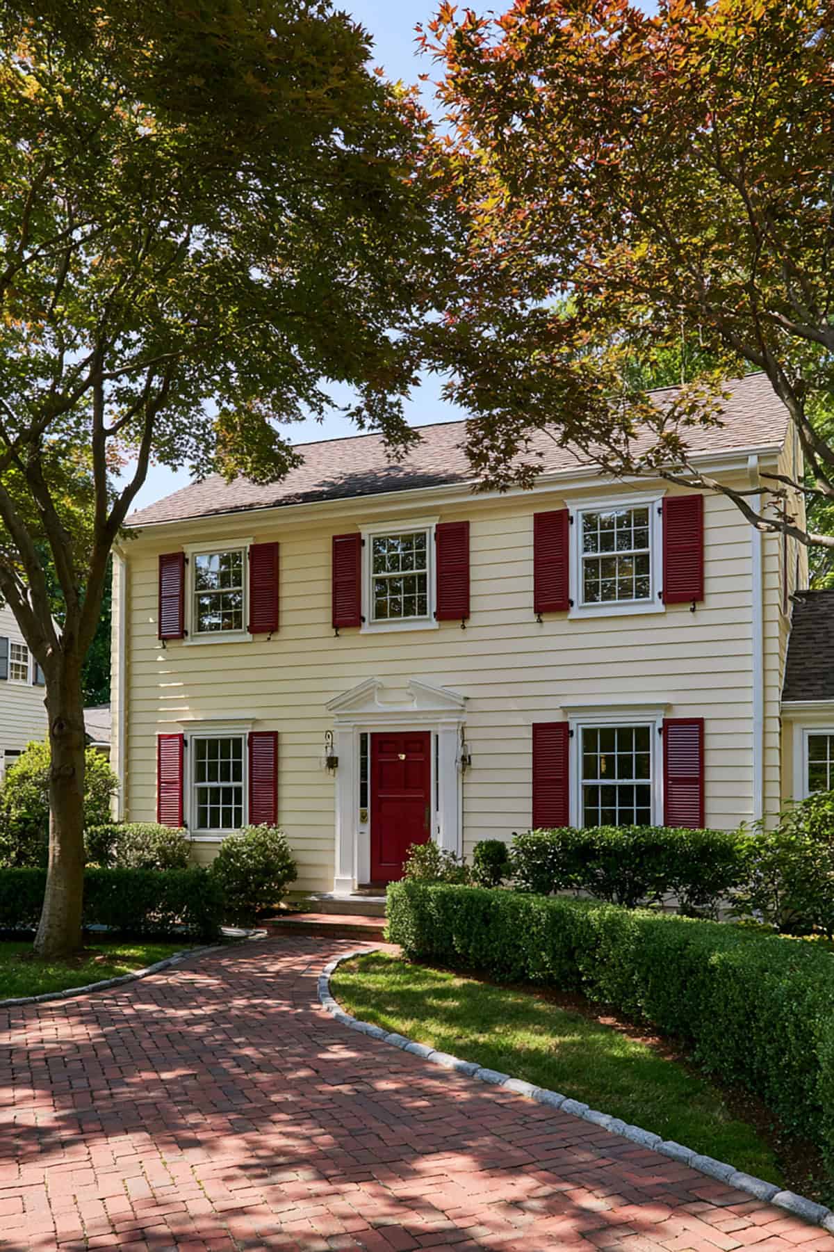 Red Shutters With Historic Cream Colonial