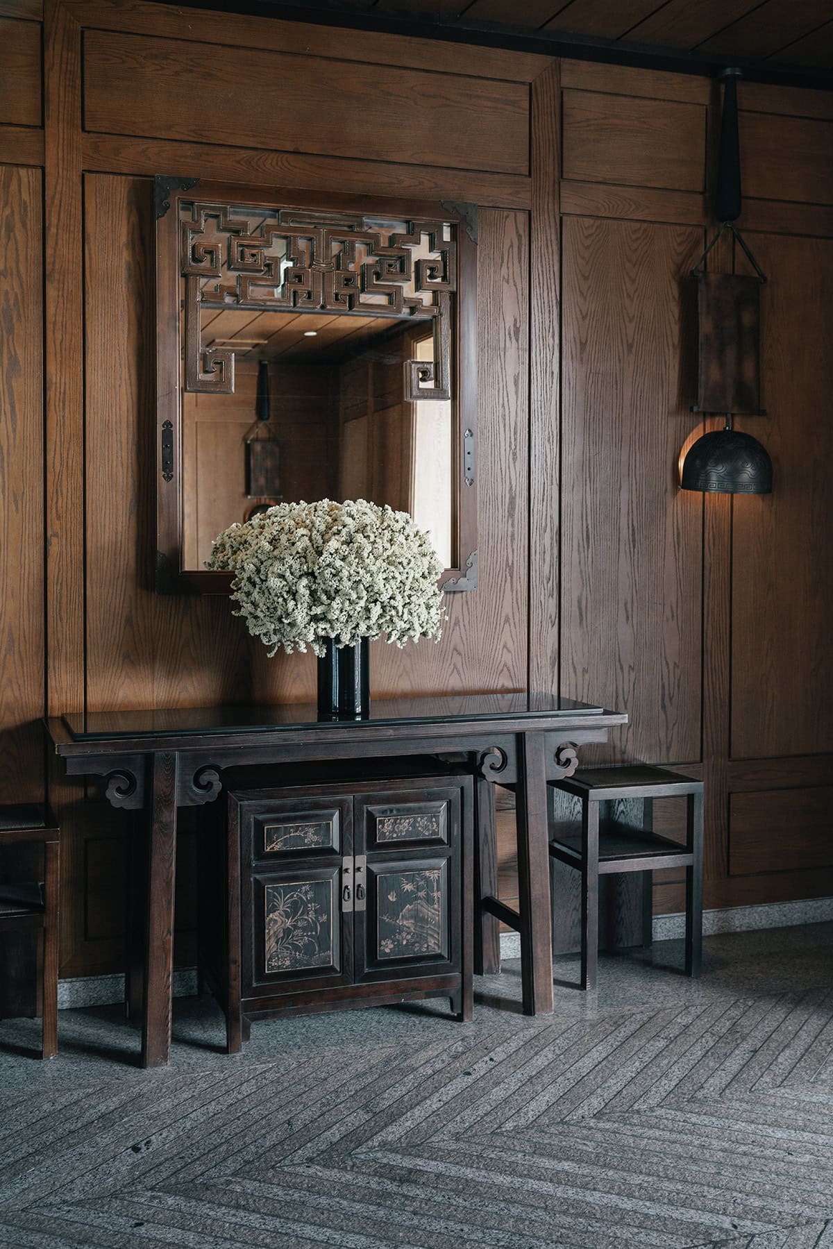 Asian Inspired Console Table in a Wood Clad Room