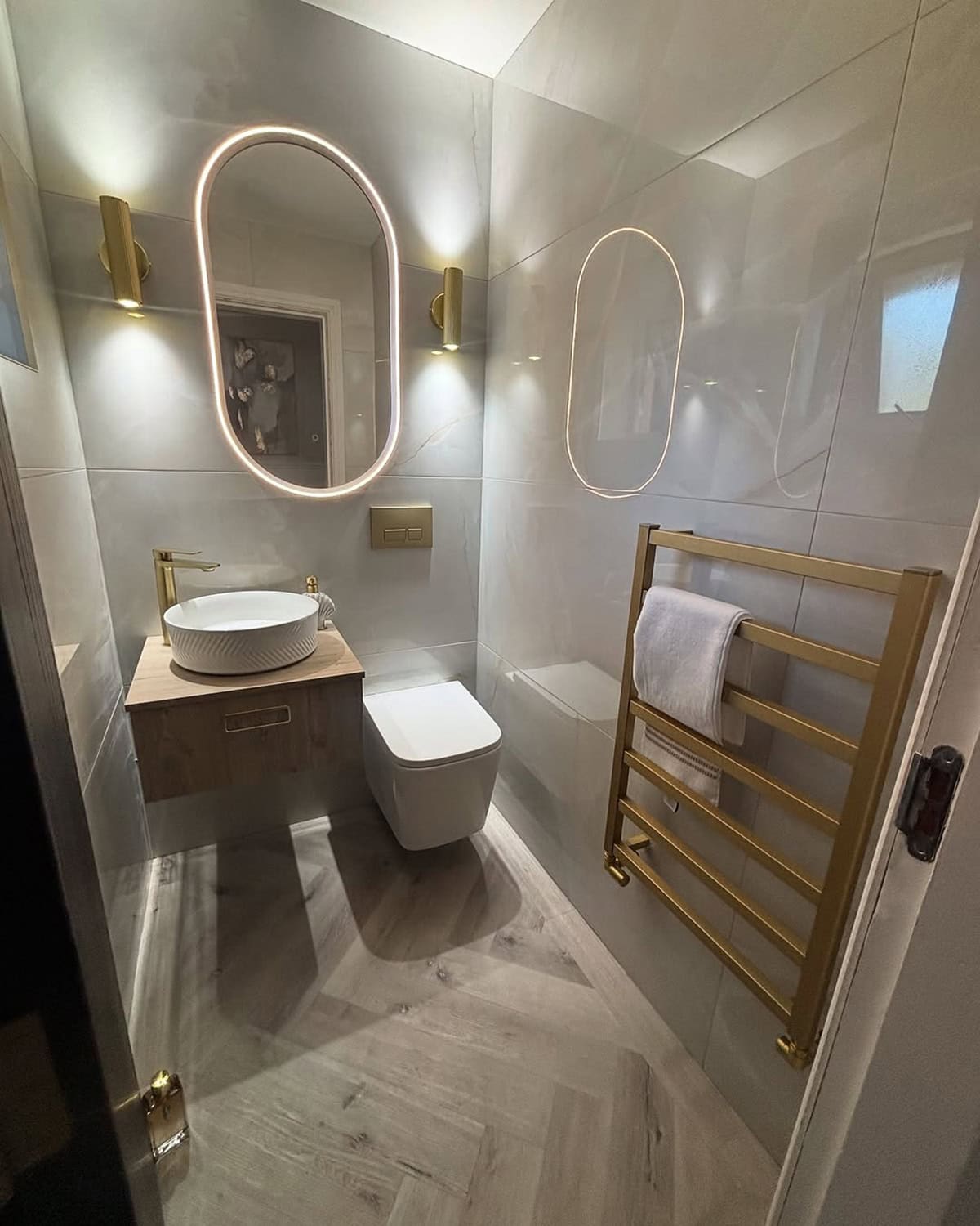 Backlit Mirror and Sconces