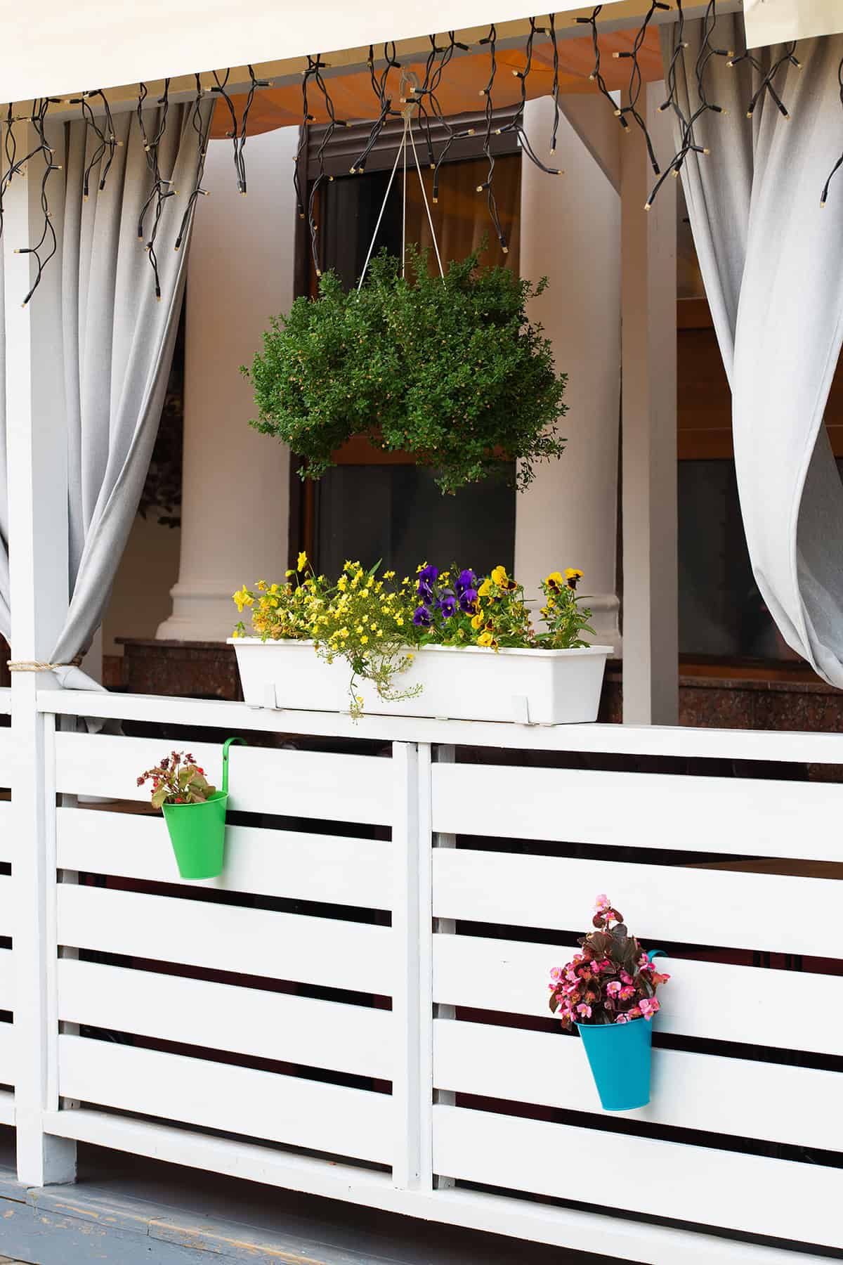 Hanging Planters on a Modern Pallet Fence