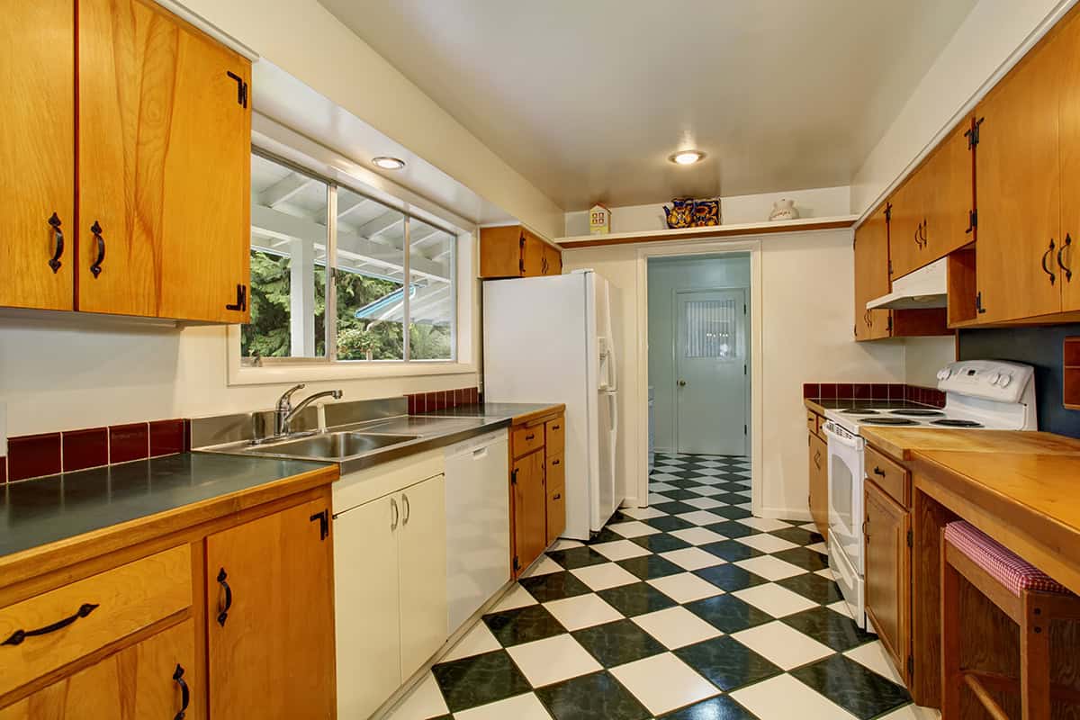 Mid Century Narrow Kitchen with Two Tone Cabinets
