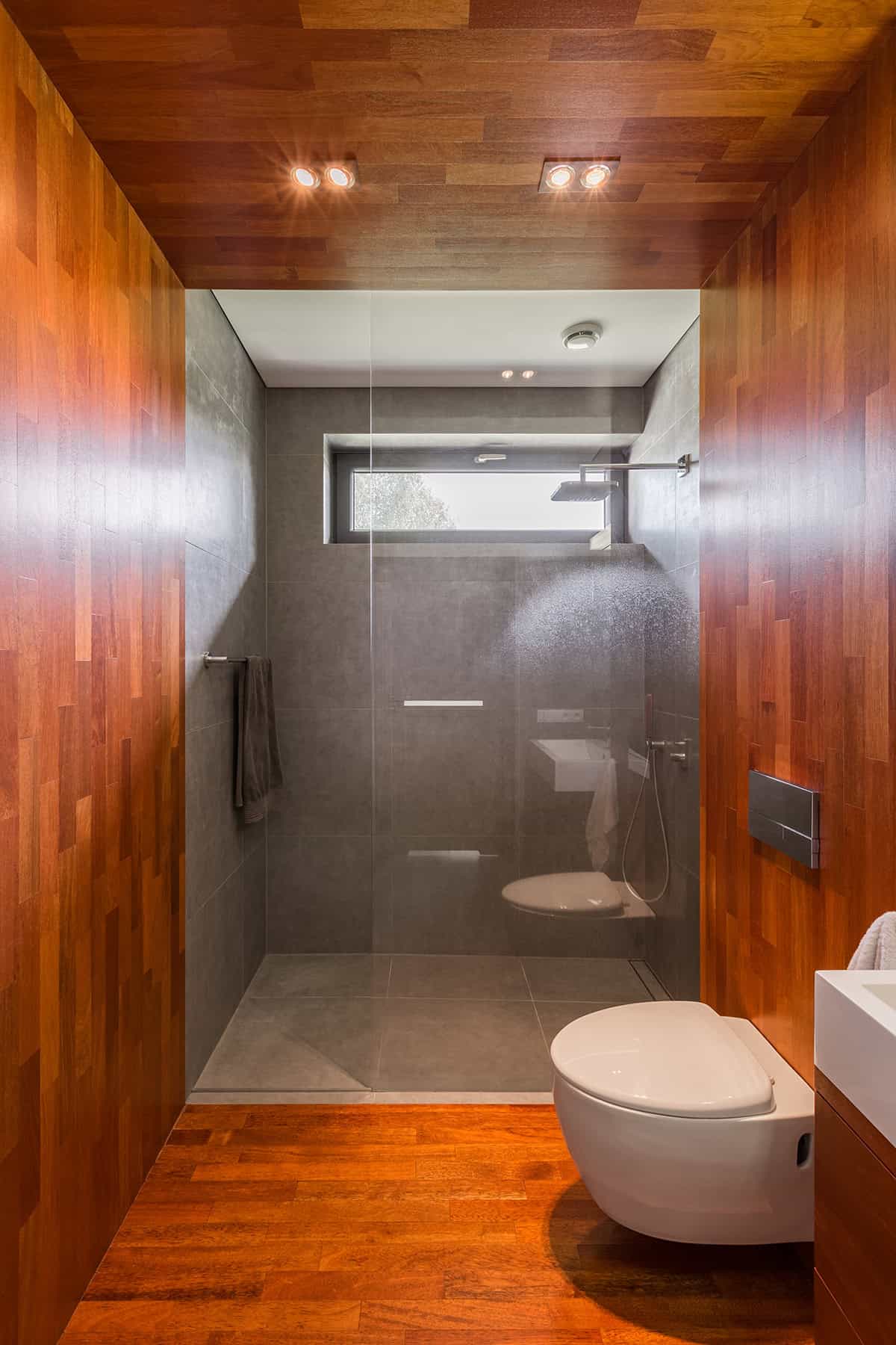 Minimalist Shower with Warm Wood Accents