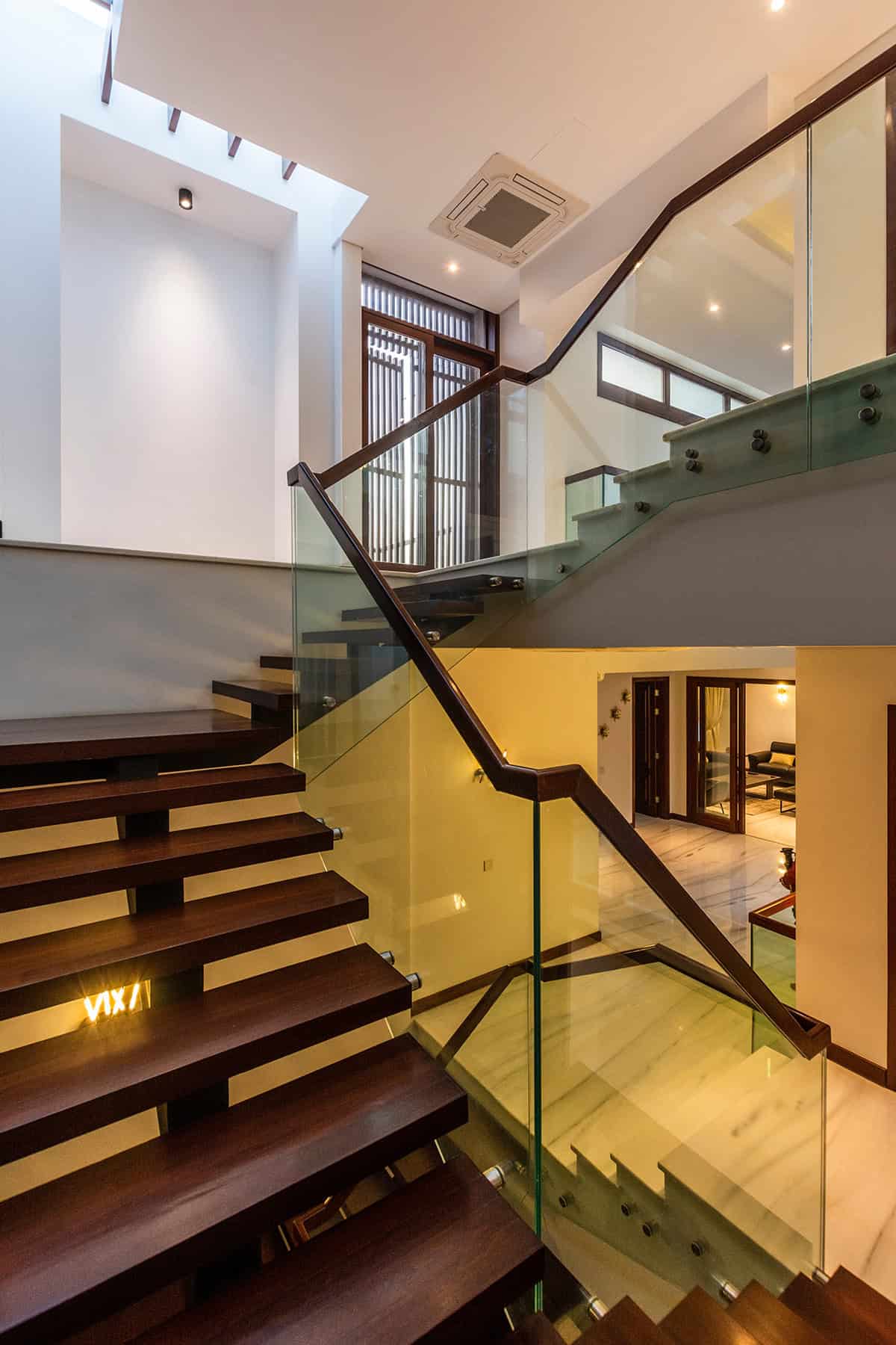 Modern Stair Landing with Glass Railings