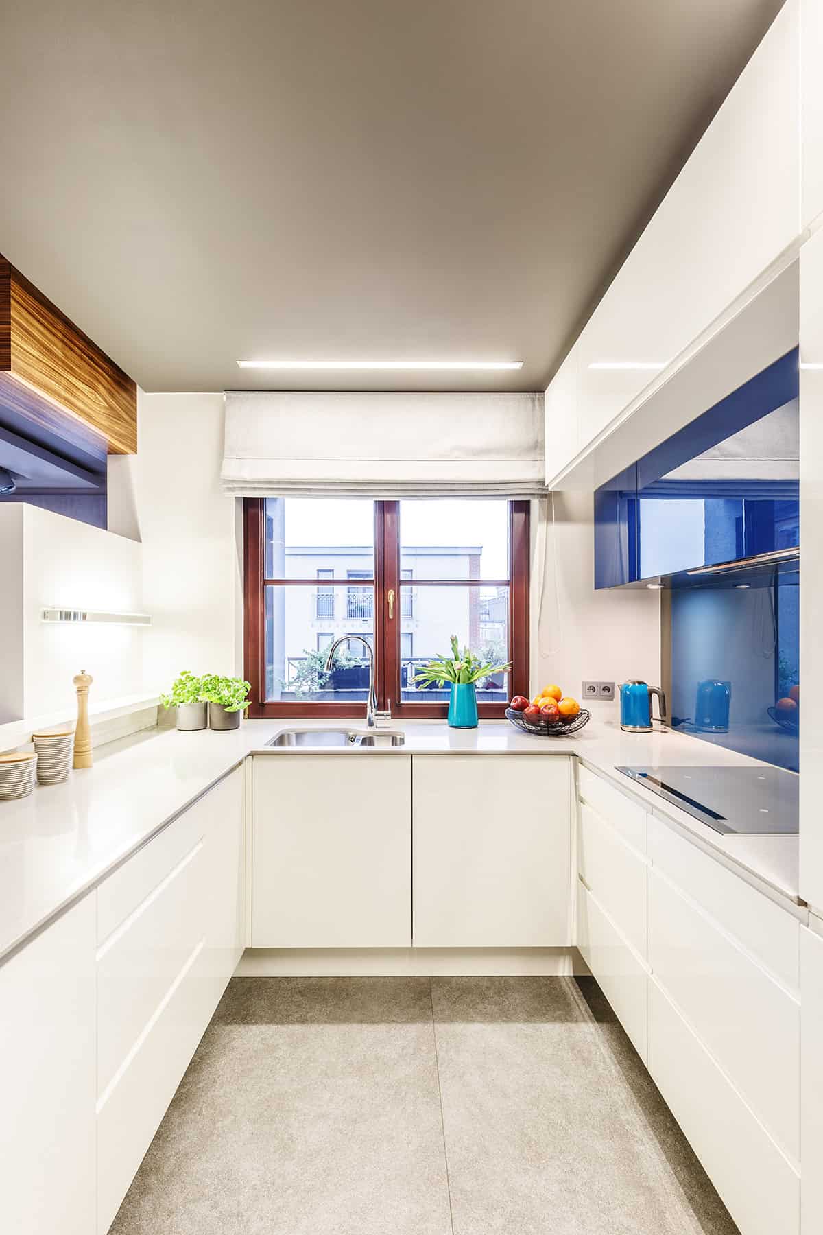 Sleek Modern Narrow Kitchen with Glossy Cabinets