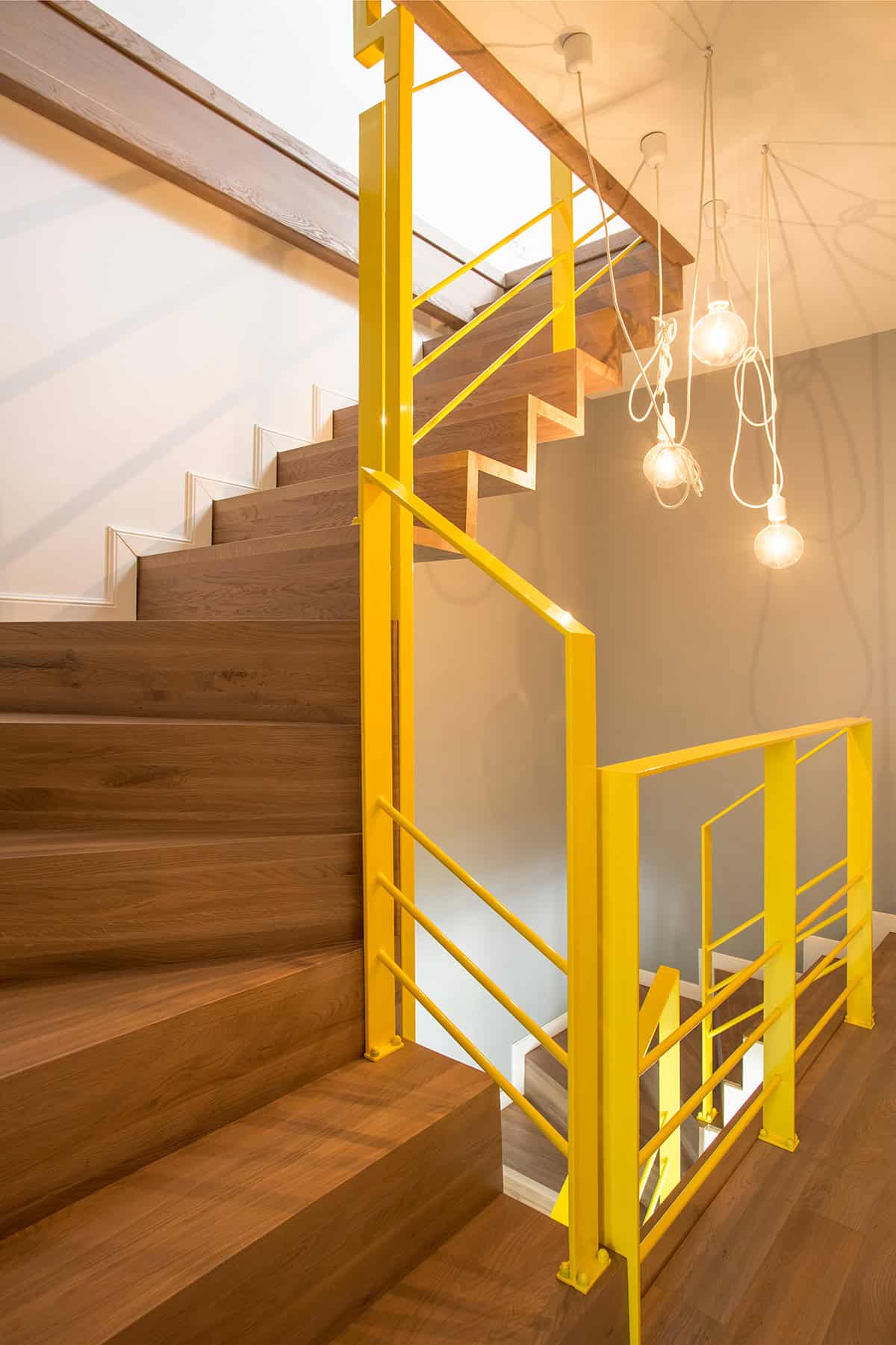Stair Landing with Bold Yellow Railings