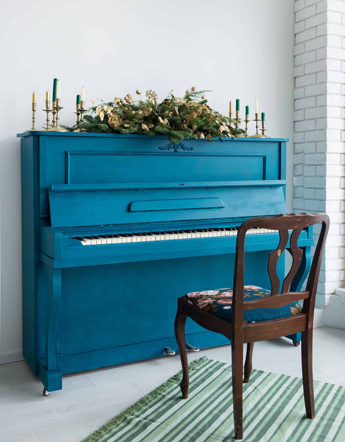 Blue Painted Old Piano Decorated with Christmas Garland