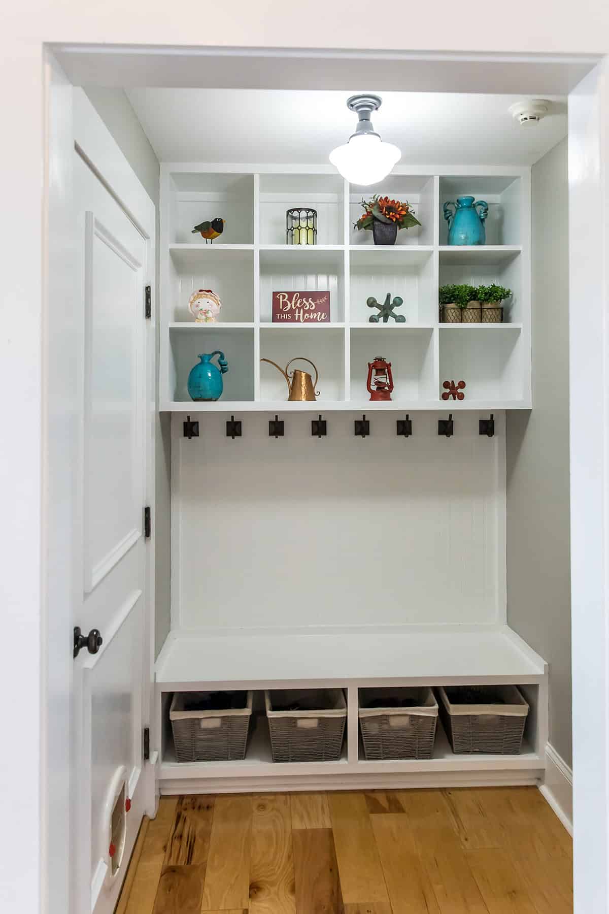 Compact Mudroom with Built In Shelves and Hooks