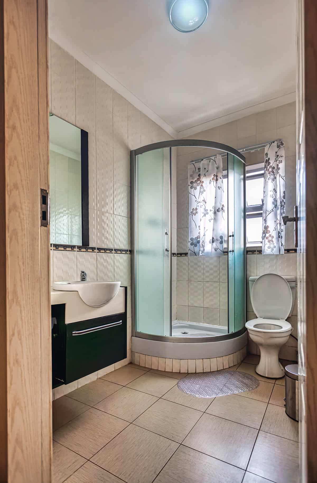 Curved Corner Shower with Glass Doors