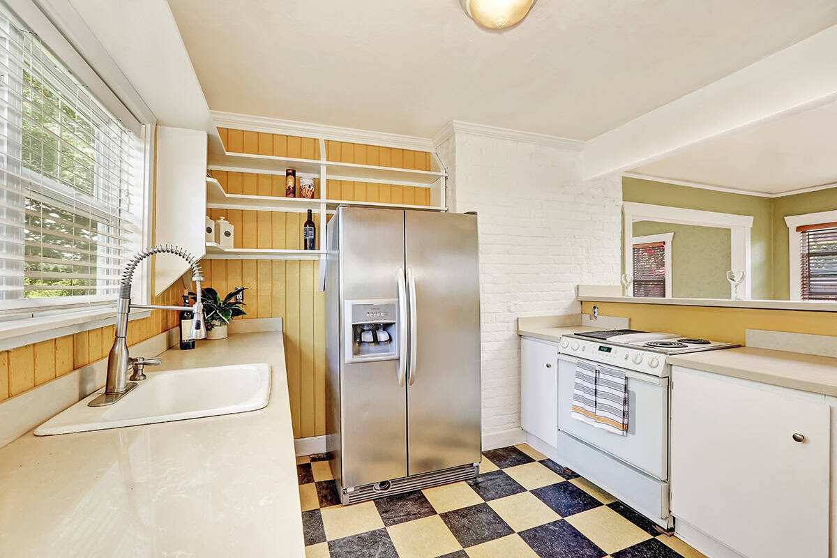 Retro U Shaped Kitchen with Checkerboard Flooring