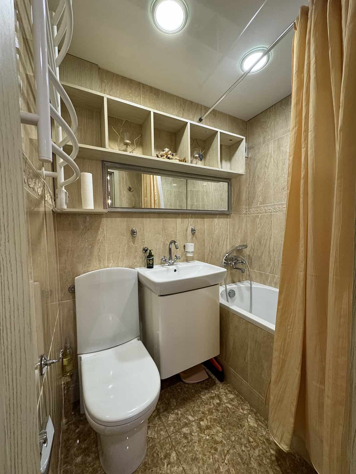 Tall Cubby Shelves Over the Toilet
