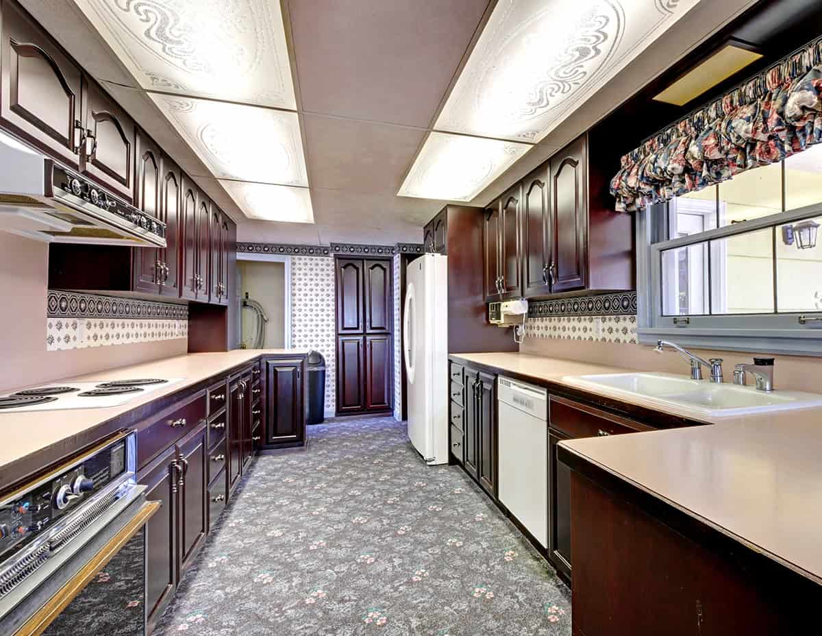 Traditional Galley Kitchen With Dark Wood Cabinets