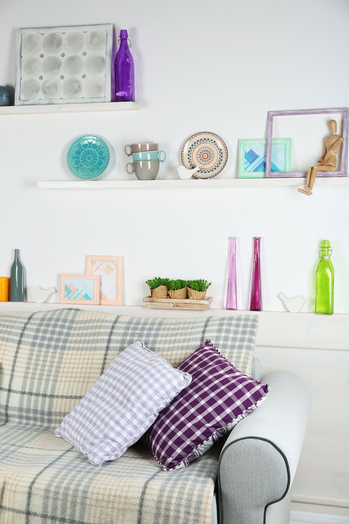 Eclectic Shelf Styling Above the Sofa