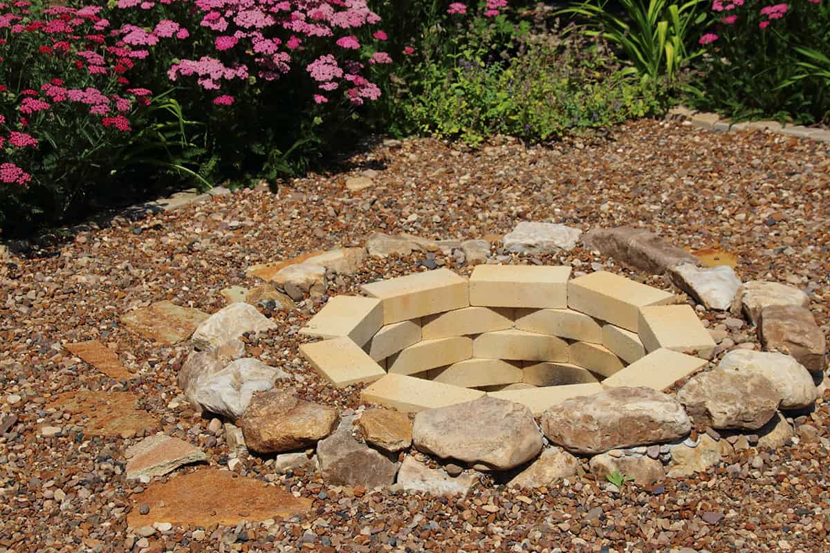 Fire Pit with Mixed Brick and Boulder Border