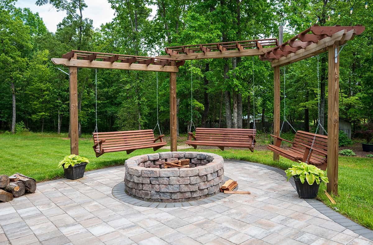 Hanging Swing Benches Around a Brick Fire Pit