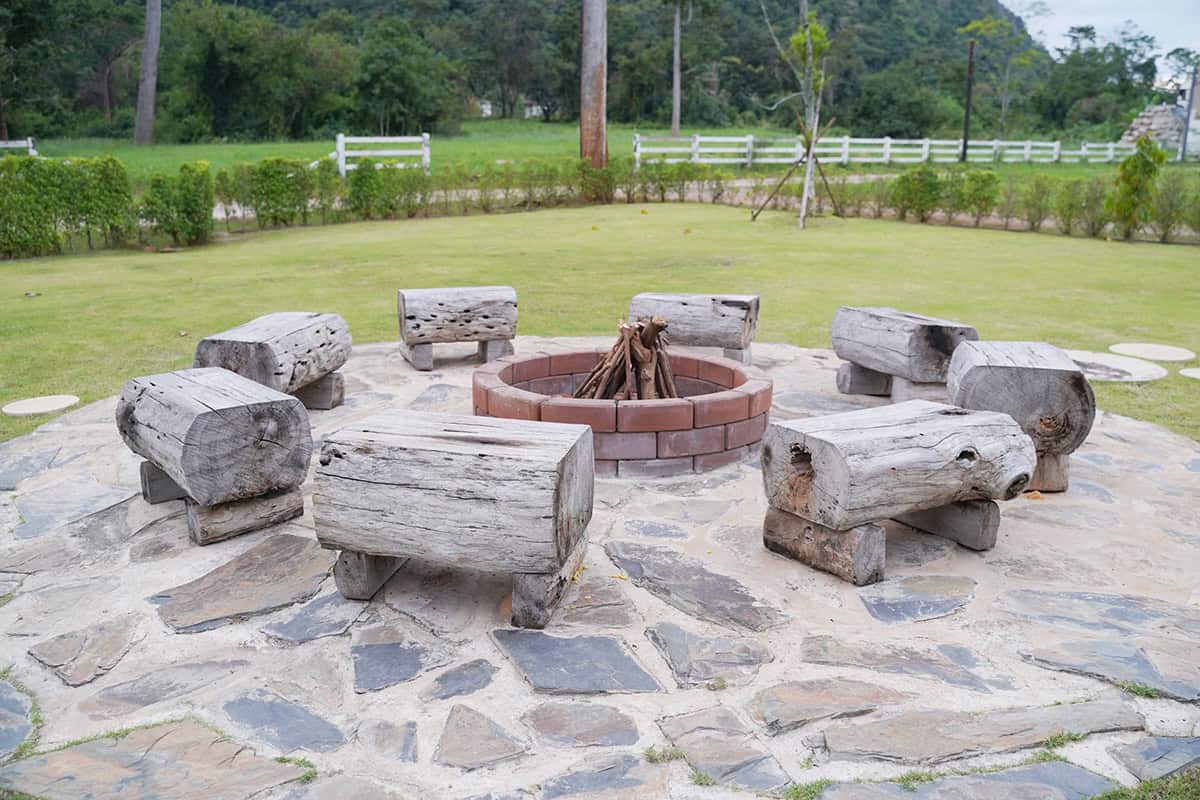 Log Seating and Red Brick Fire Pit