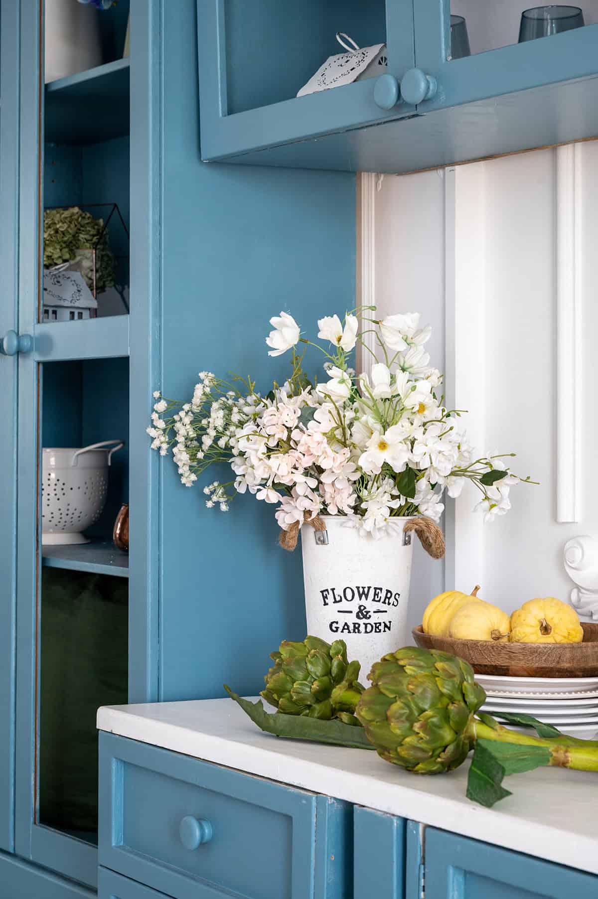 Provence Style Kitchen with Blue Cabinets and Decorative Touches