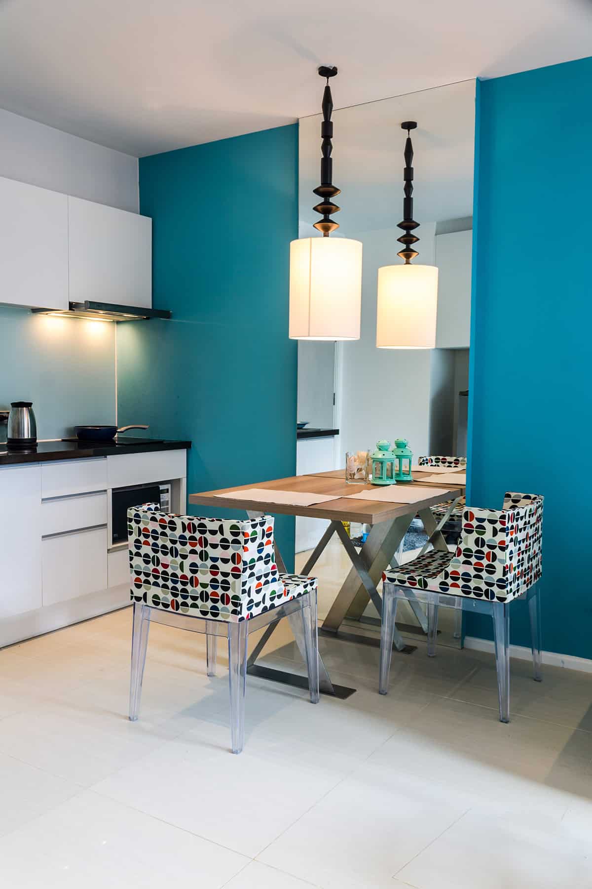 Small Modern Kitchen with Blue Cabinets and Dining Table