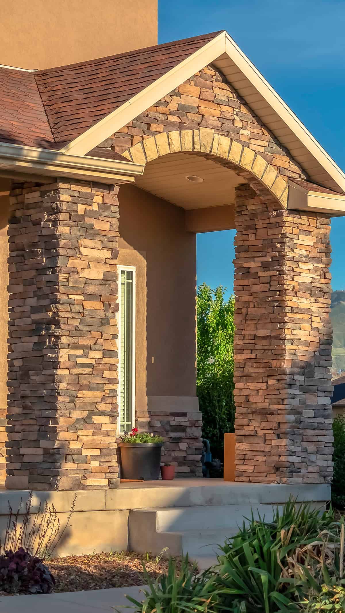 Stacked Stone Porch Columns with Arched Entryway