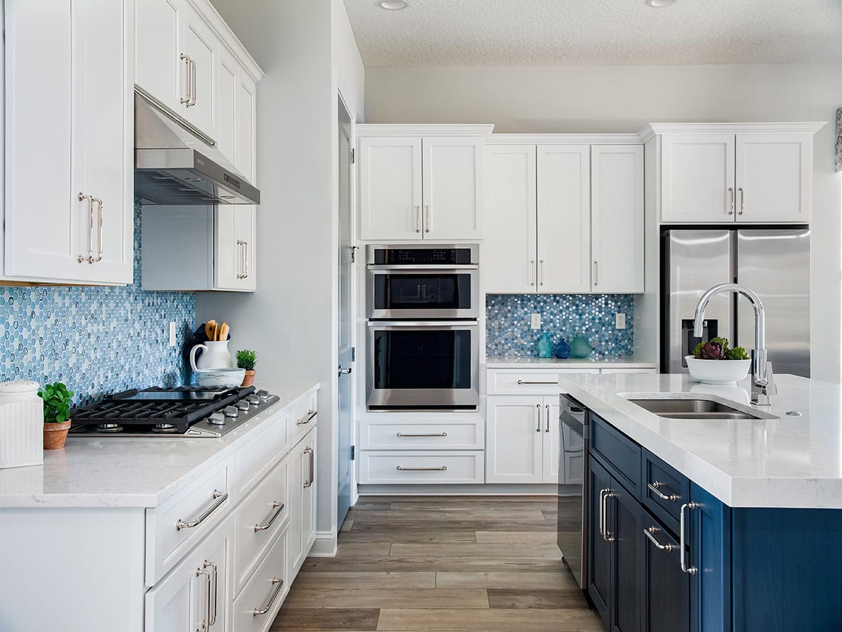 Transitional Kitchen with Blue Accents and Large Island