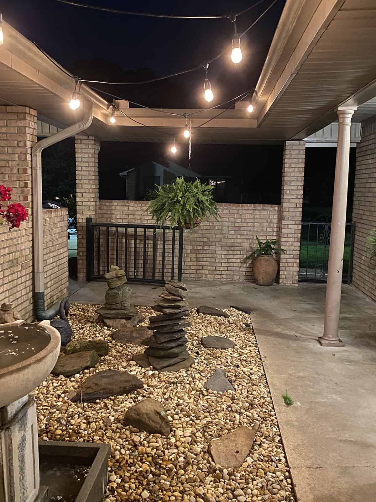 Zen Patio Decor with String Lights and Stacked Stones