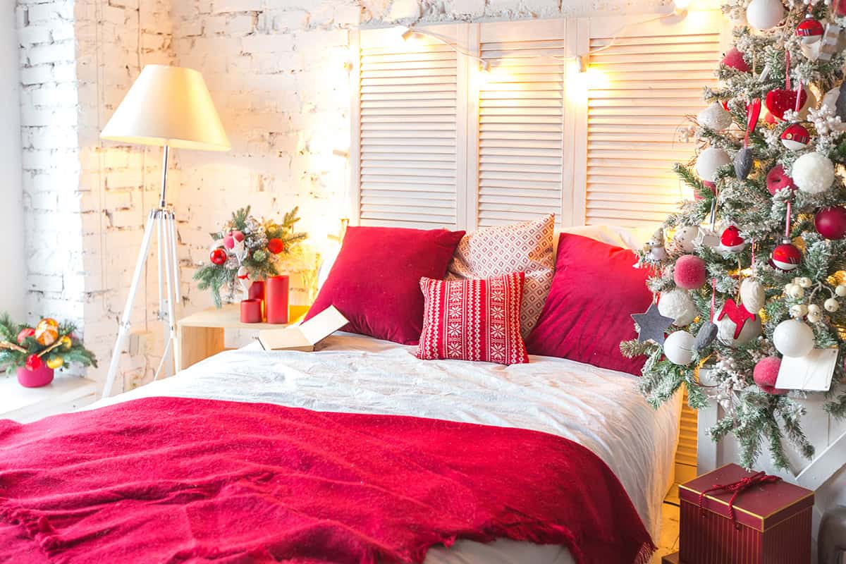 Bedroom with Red Accents and Christmas Tree